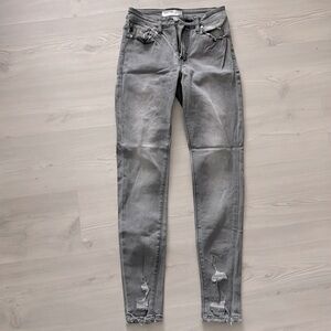 Mid rise gray KanCan skinny jeans with distressed look